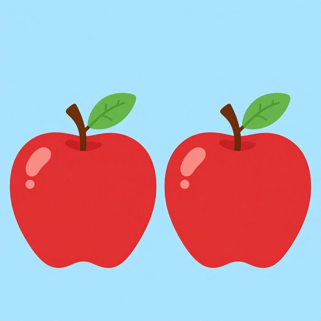 Duas maçãs vermelhas brilhantes idênticas lado a lado sobre uma superfície limpa.